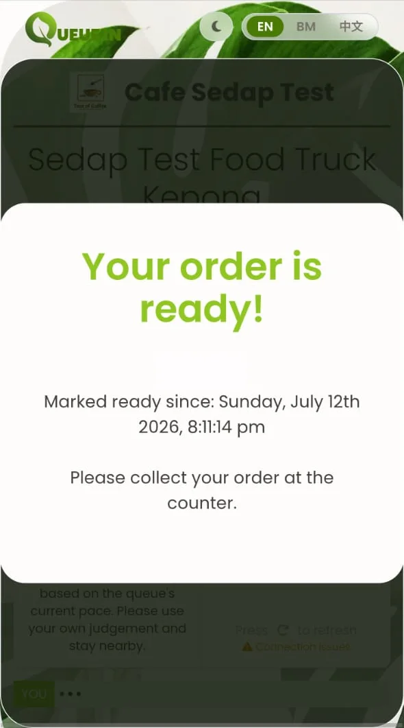 QueueIn cafe pickup page telling a customer that their order is ready for collection at the counter